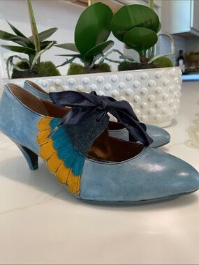 Poetic License London “Flapper” heels. Teal, dark blue, mustard. Size 6.